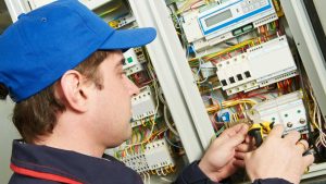 Electrician checking electrical safety 